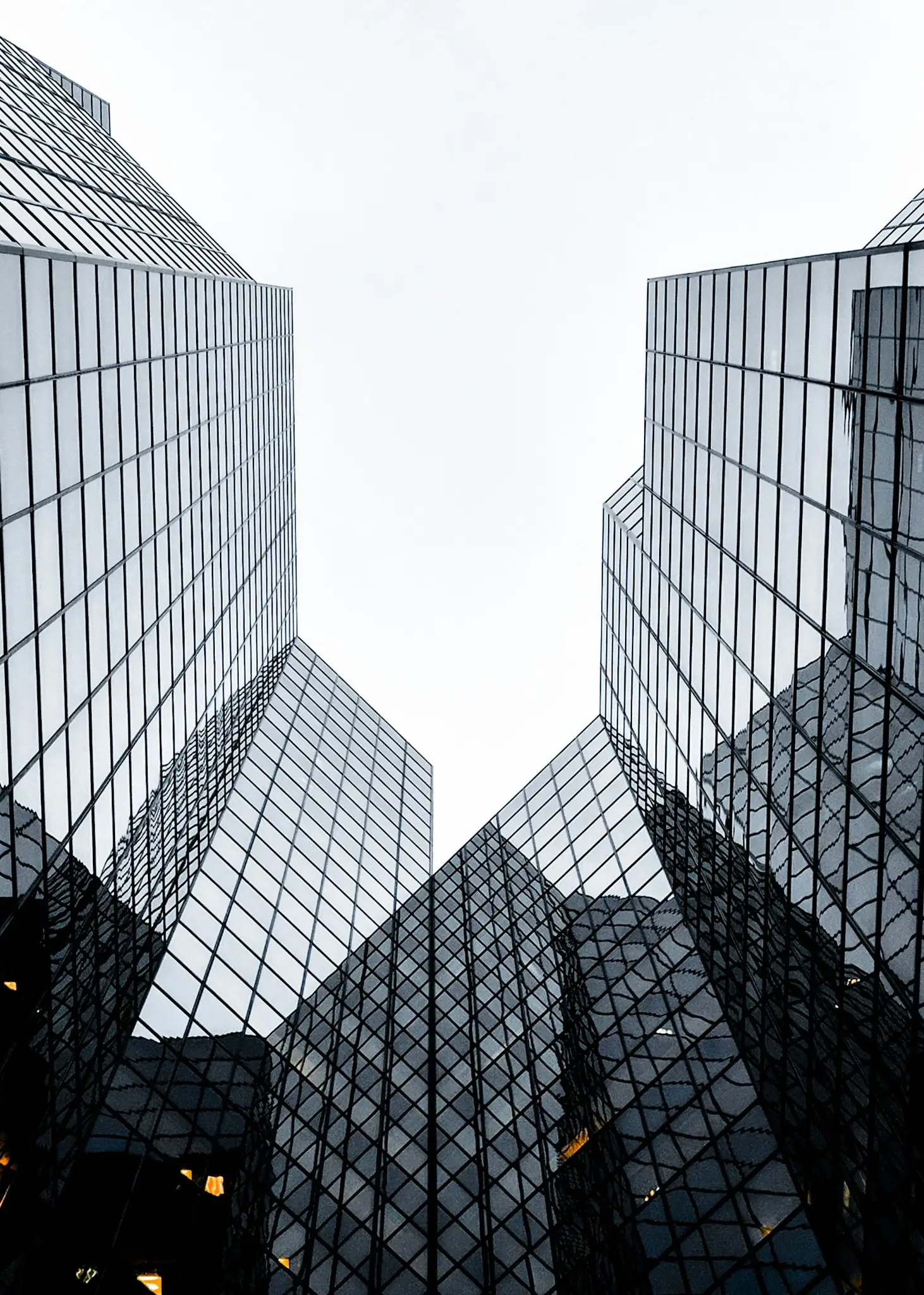 Residential towers seen from below against the sky