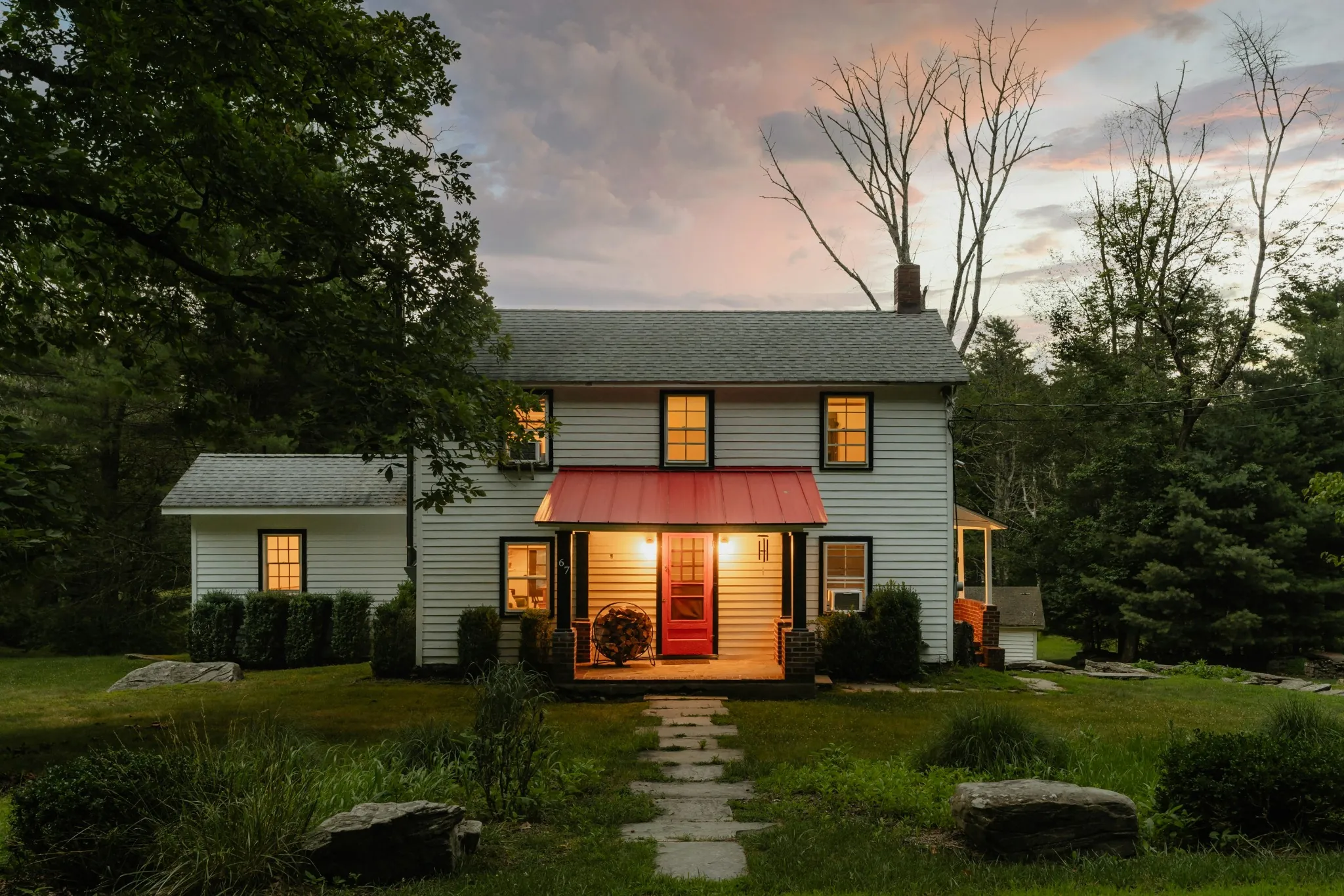 A residence at dusk seen from the street